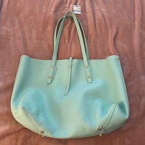 J. McLaughlin women’s leather handbag in the color mint.